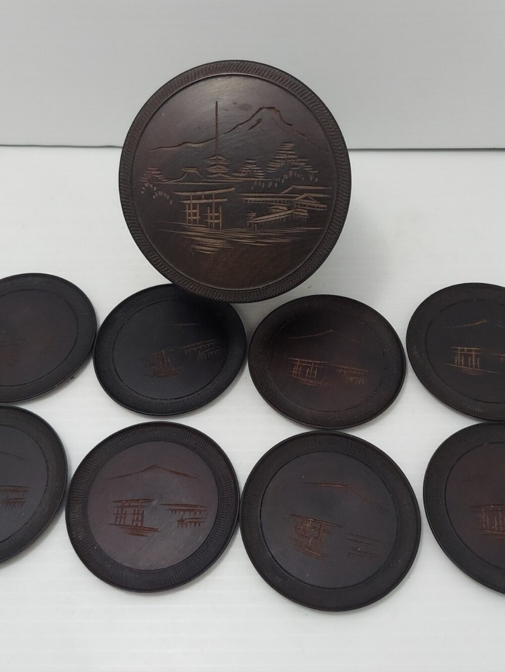 Set of 8 Dark Wood Carved Coasters with Scenic Inlay Of Mount Fuji